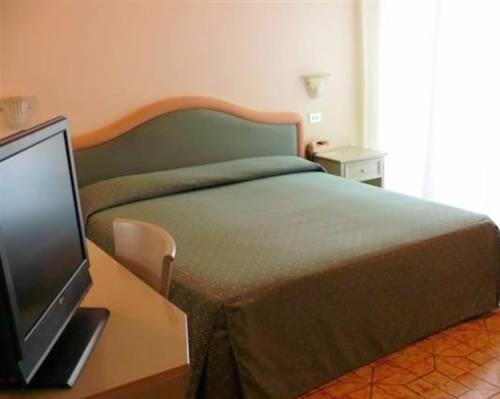 Postel nebo postele na pokoji v ubytování Hotel Britannia