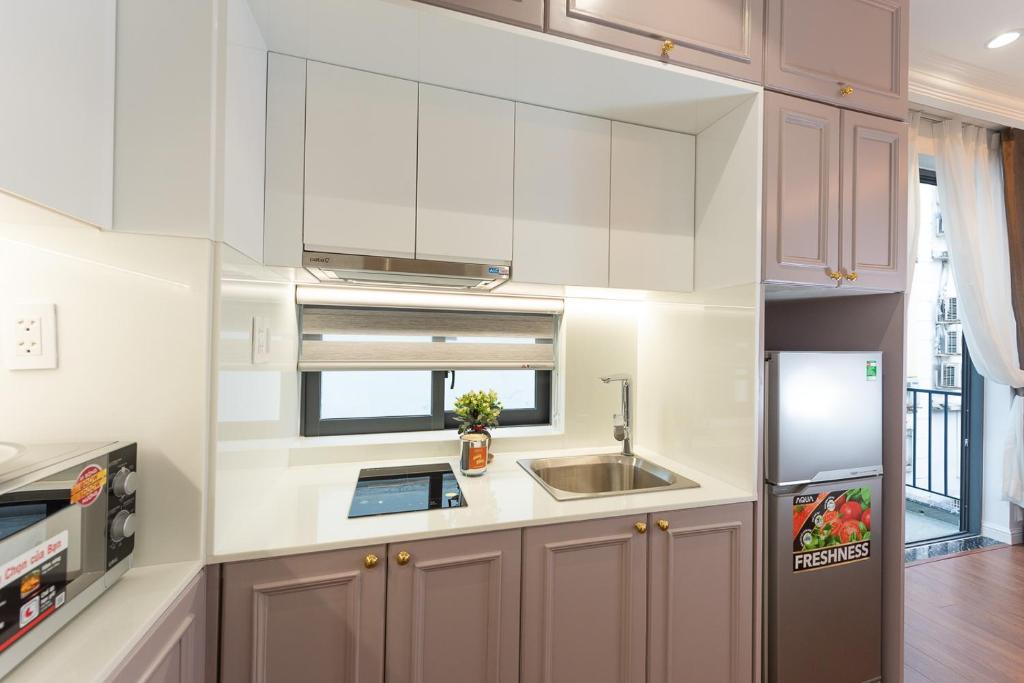 Kuchyň nebo kuchyňský kout v ubytování Ngan Ha 2 Apartment