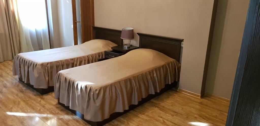 Voodi või voodid majutusasutuse Ruzan hotel toas