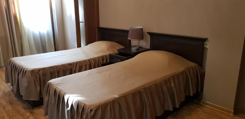 Voodi või voodid majutusasutuse Ruzan hotel toas