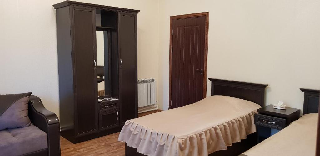 Voodi või voodid majutusasutuse Ruzan hotel toas