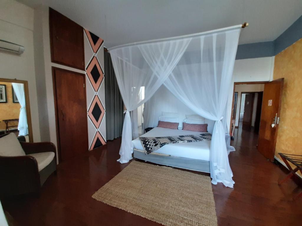 Postel nebo postele na pokoji v ubytování FIGTREE GUESTHOUSE