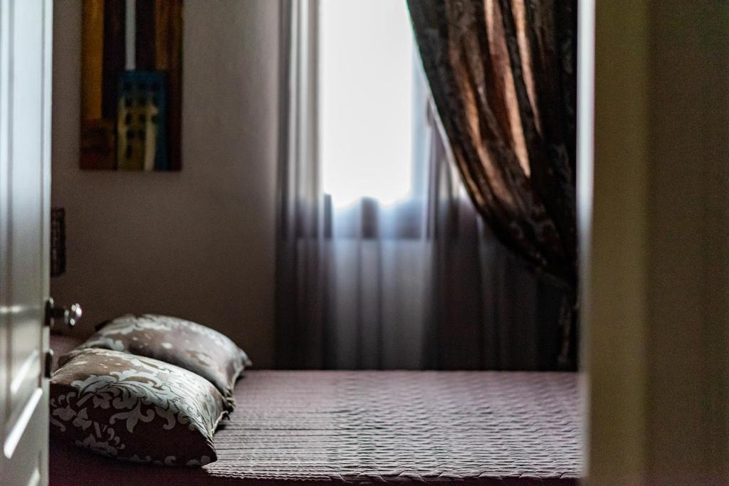 Postel nebo postele na pokoji v ubytování Ξενώνας Γούσιας