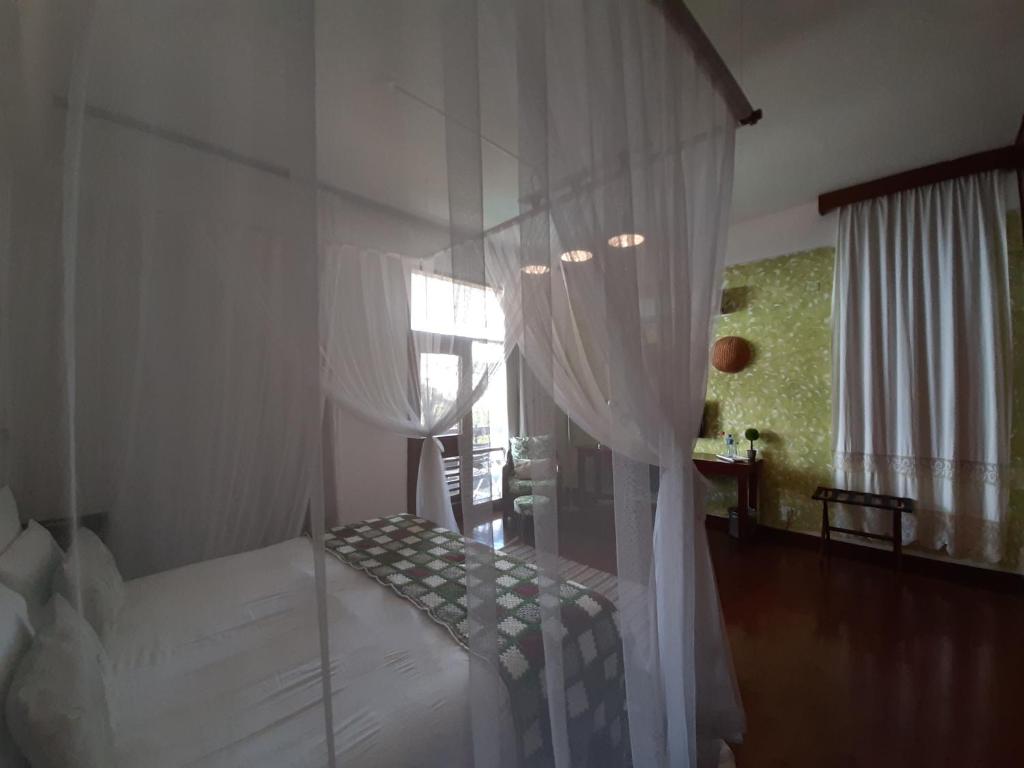 Postel nebo postele na pokoji v ubytování FIGTREE GUESTHOUSE