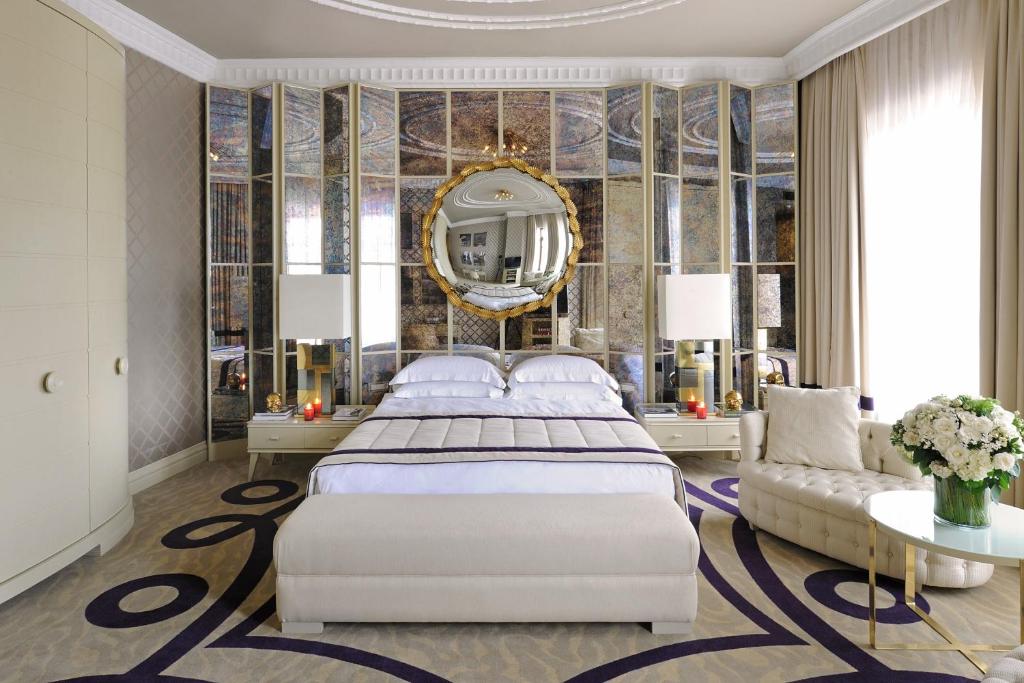 a large white bed in a large room at Taxim Hill Hotel in Istanbul