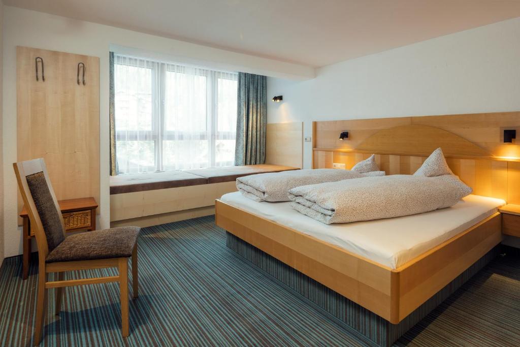 Postel nebo postele na pokoji v ubytování Hotel Restaurant Claudia - inklusive SUPER SOMMER CARD