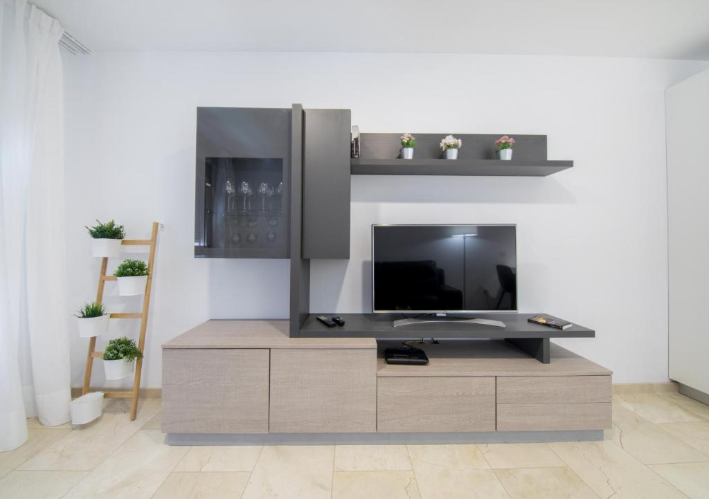 Televízia a/alebo spoločenská miestnosť v ubytovaní Ferreras Canteras Home By CanariasGetaway