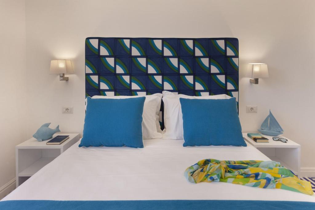 Postel nebo postele na pokoji v ubytování Gala Residence Villa Giovanna