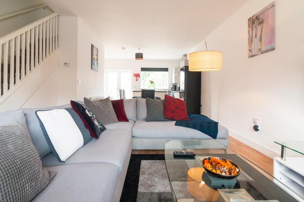 a living room with a couch and a table at Mosh Aparthotel in Manchester