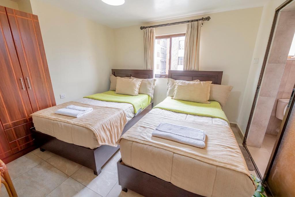 Postel nebo postele na pokoji v ubytování Joy Palace Hotel