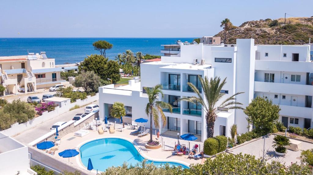 an image of a building with a swimming pool and the ocean at Moscha Hotel in Faliraki