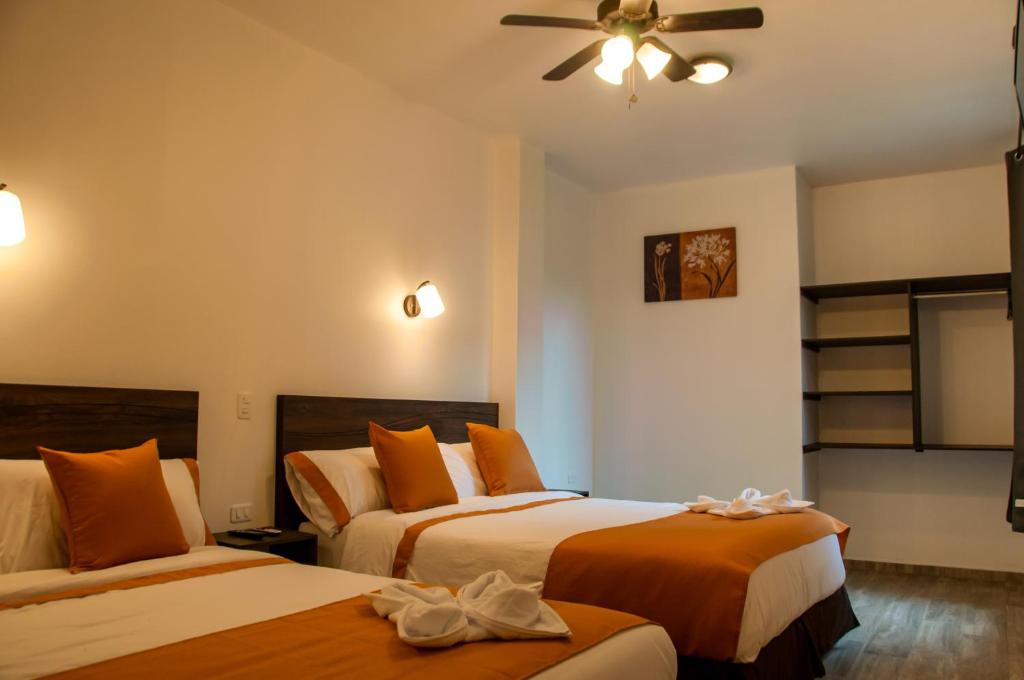 Postel nebo postele na pokoji v ubytování Toucan Platinum Suites Aparthotel