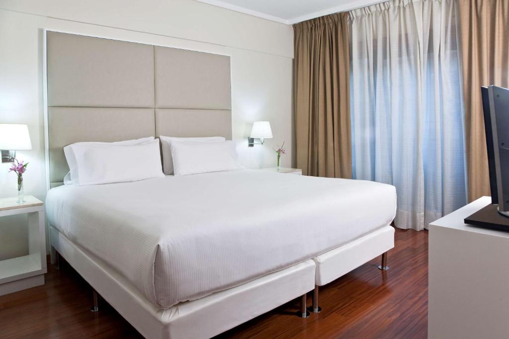Cama ou camas em um quarto em NH Buenos Aires Florida