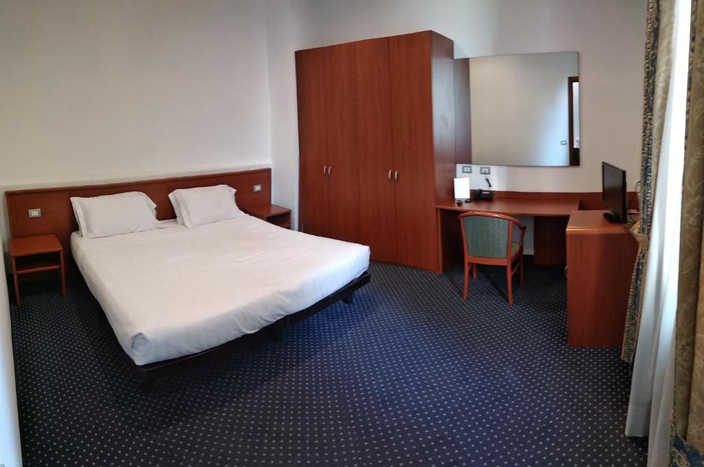 Postel nebo postele na pokoji v ubytování Hotel Glis
