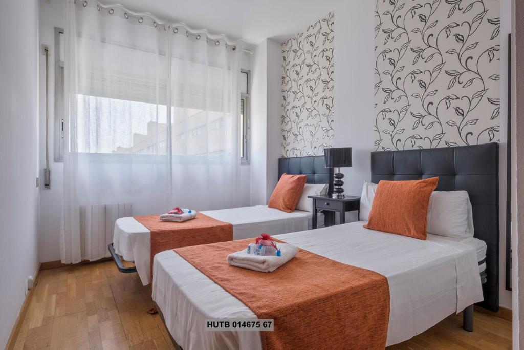 Posteľ alebo postele v izbe v ubytovaní Alcam Vila Olímpica