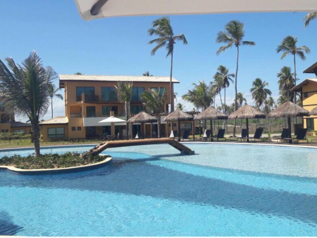 Bazén v ubytování Apt Coral Azul Iberostate Praia do Forte nebo v jeho okolí