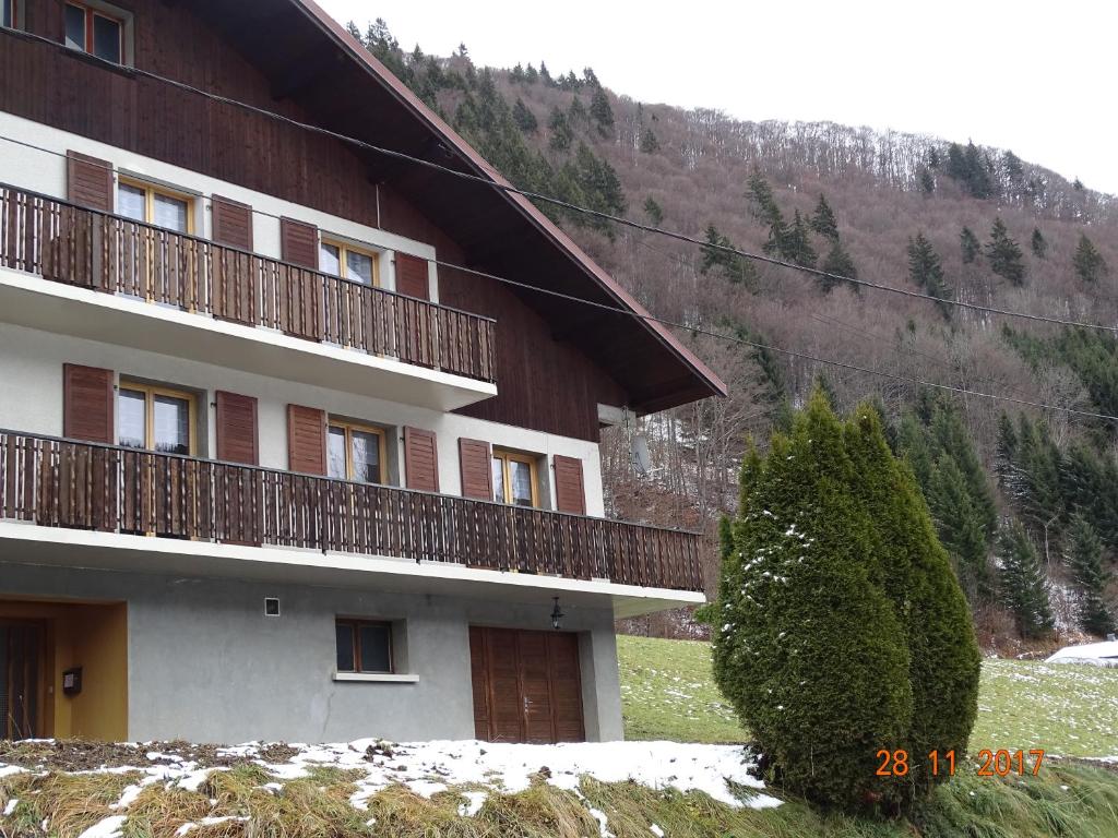 a building with balconies on the side of it at Pic de la Corne in Abondance