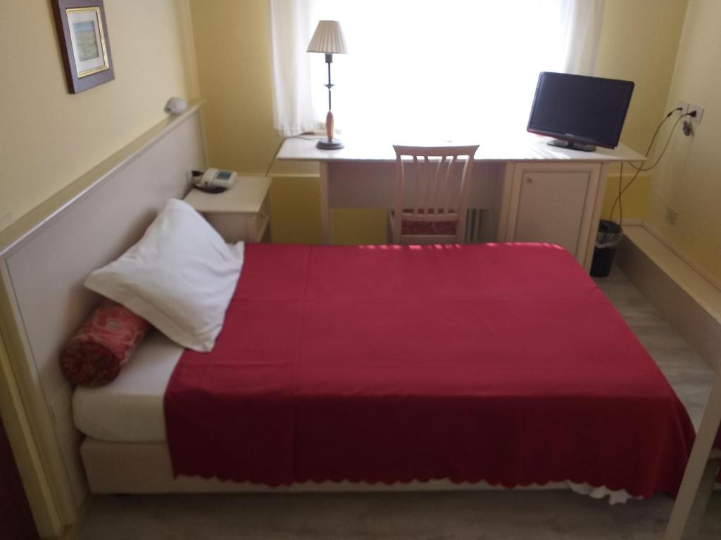 Postel nebo postele na pokoji v ubytování Hotel Monna Lisa