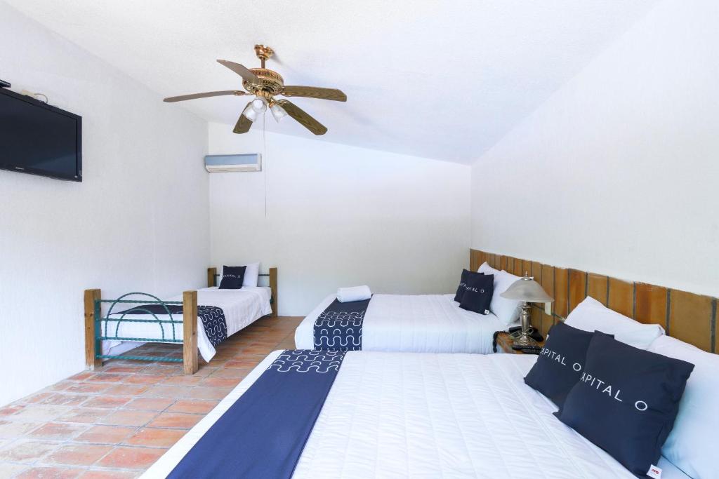 Postel nebo postele na pokoji v ubytování Cotlamani Hotel Aventura