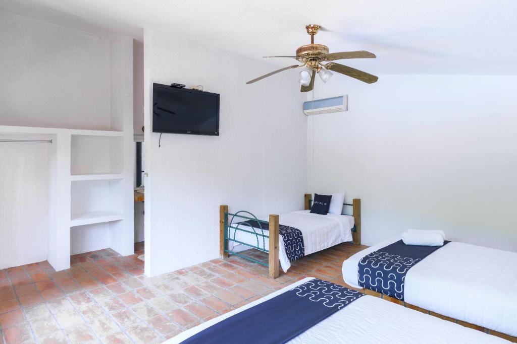 Postel nebo postele na pokoji v ubytování Cotlamani Hotel Aventura