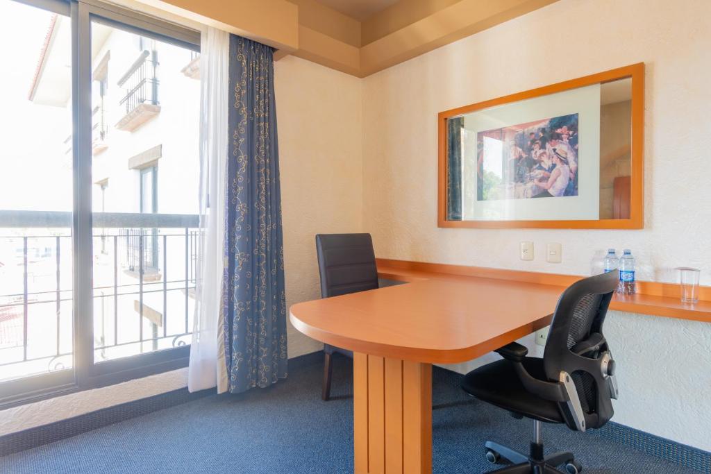 TV a/nebo společenská místnost v ubytování Hotel Flamingo Inn