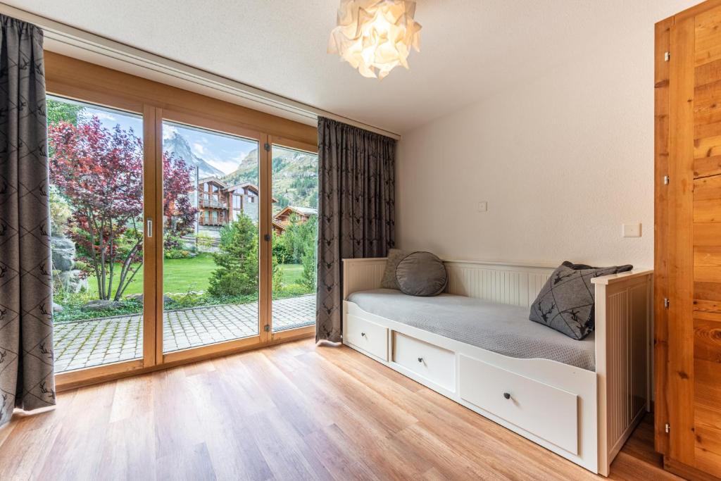 Voodi või voodid majutusasutuse Haus Alpine toas