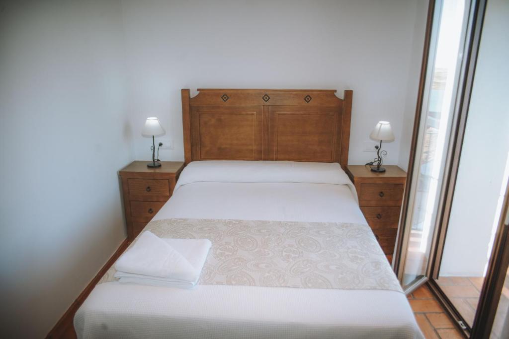 Postel nebo postele na pokoji v ubytování Casa Rural Los Belloso