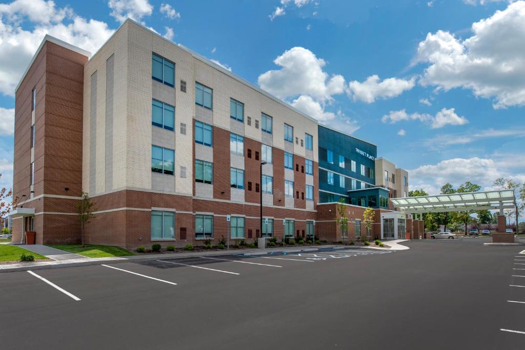 a parking lot in front of a building at Hyatt Place Indianapolis Carmel in Carmel