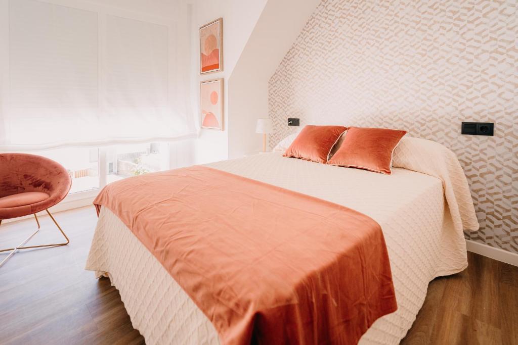 Posteľ alebo postele v izbe v ubytovaní Apartamentos Rúa Vella