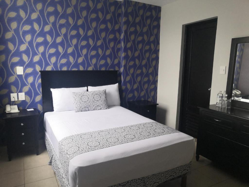 Postel nebo postele na pokoji v ubytování Hotel Costa Verde