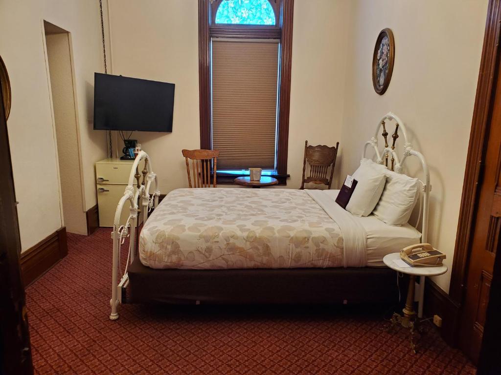 Postel nebo postele na pokoji v ubytování Manresa Castle