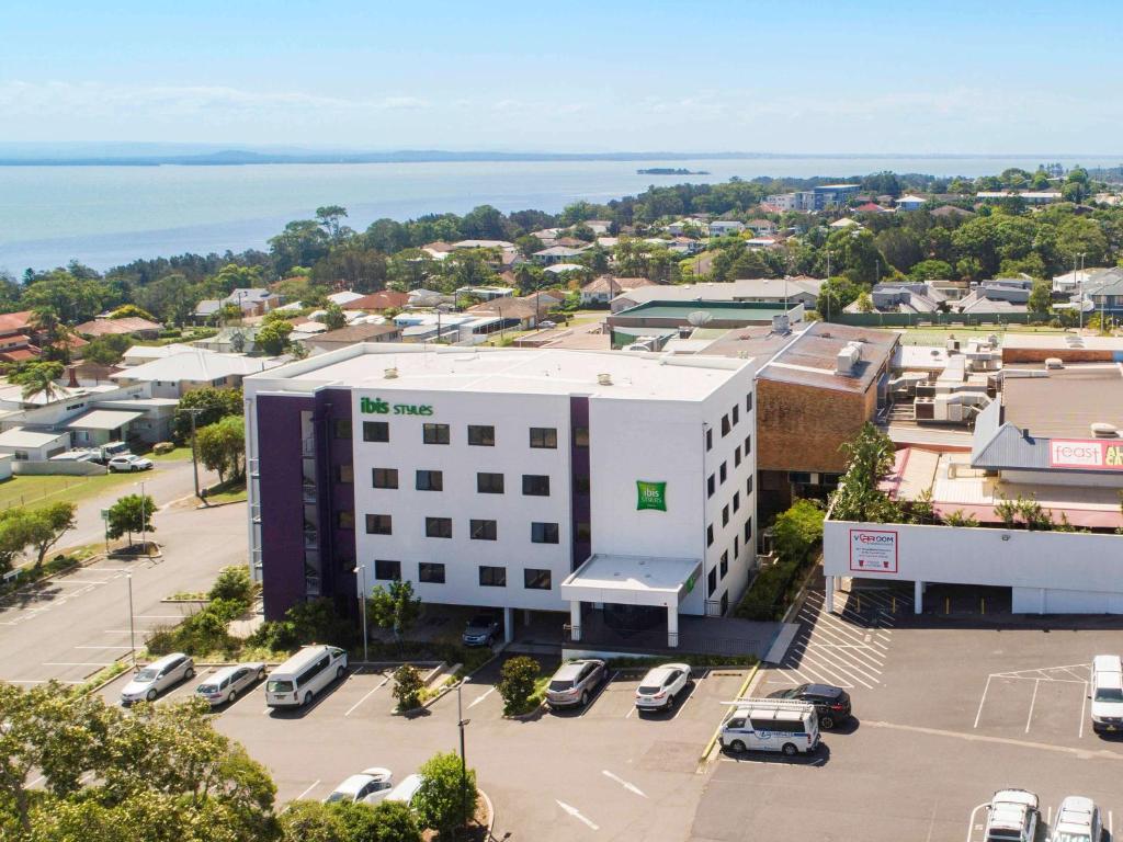 an aerial view of a building with cars parked in a parking lot at Ibis Styles The Entrance in The Entrance