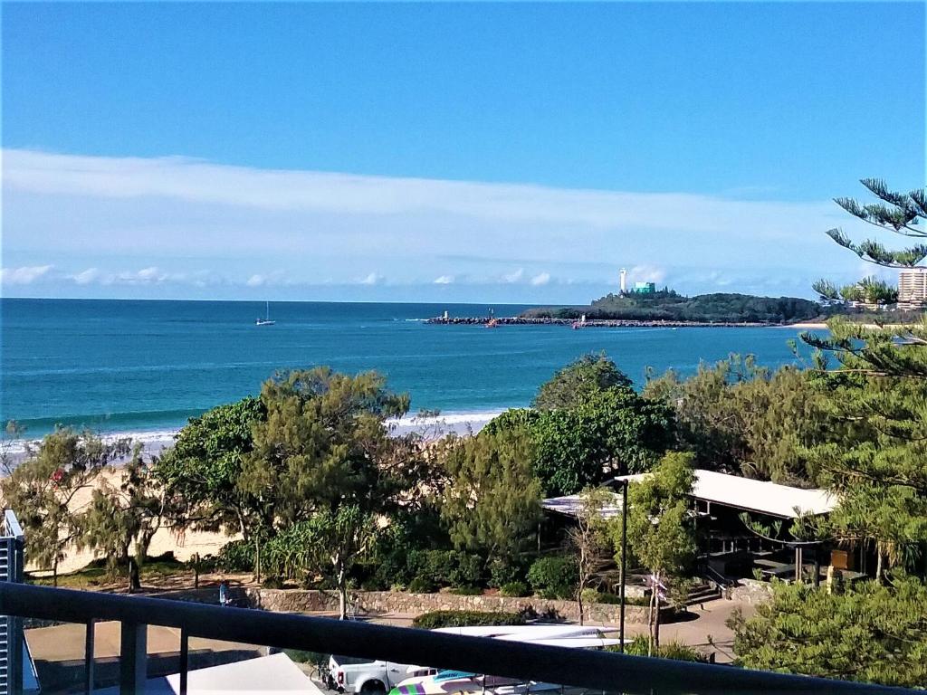a view of the beach from the balcony of a condo at Mooloolaba Beachfront Apartment in Sandcastles in Mooloolaba