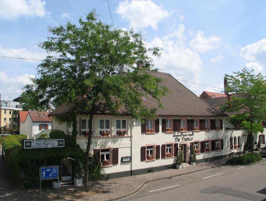 a building on the side of a street at Hotel Restaurant Da Franco in Rastatt