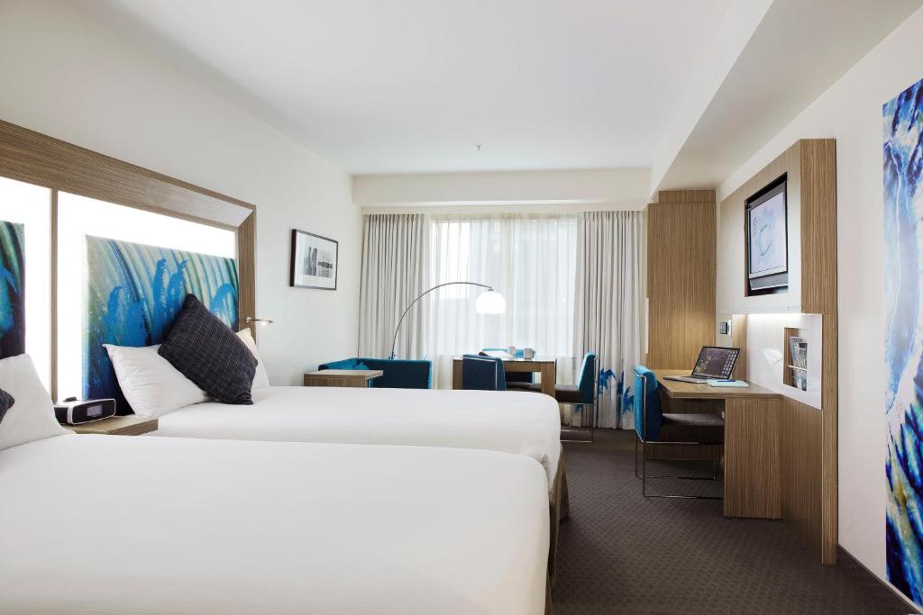 Postel nebo postele na pokoji v ubytování Novotel Tainui Hamilton
