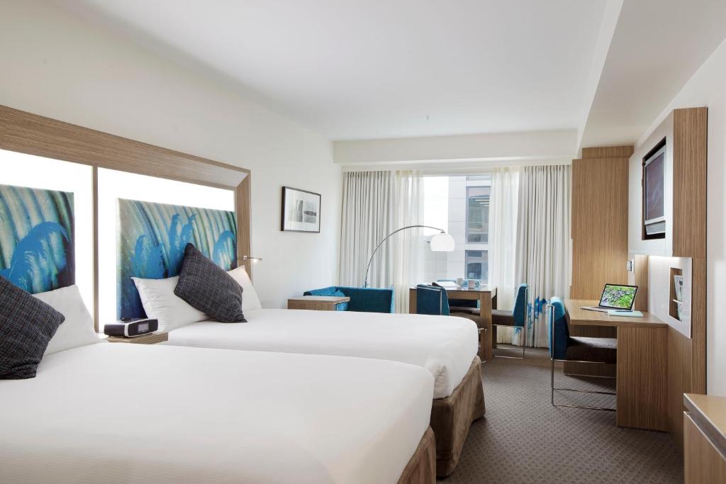 Postel nebo postele na pokoji v ubytování Novotel Tainui Hamilton