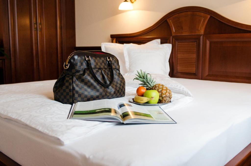 Posteľ alebo postele v izbe v ubytovaní Hotel Dorottya