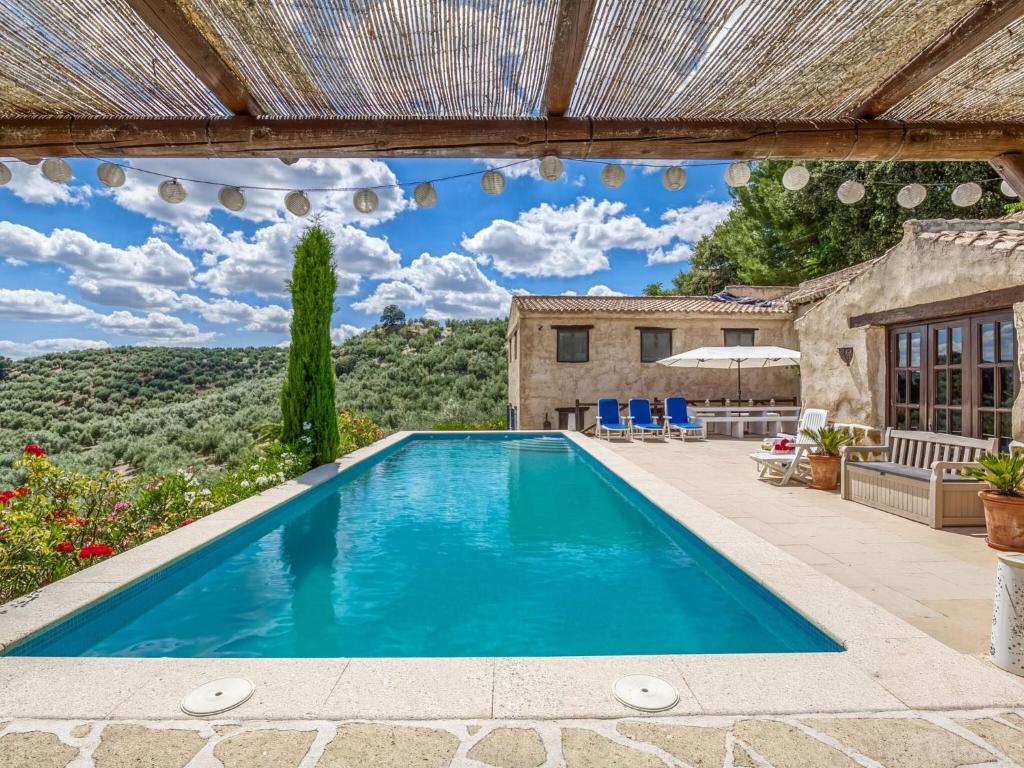 a swimming pool in the backyard of a villa at Attractive Villa in Montefrio with Private Pool in Montefrío