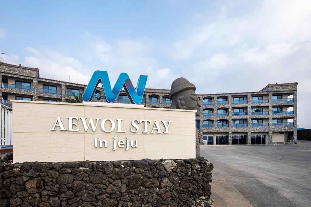 a hotel sign in front of a building at Aewol Stay in Jeju Hotel&Resort in Jeju