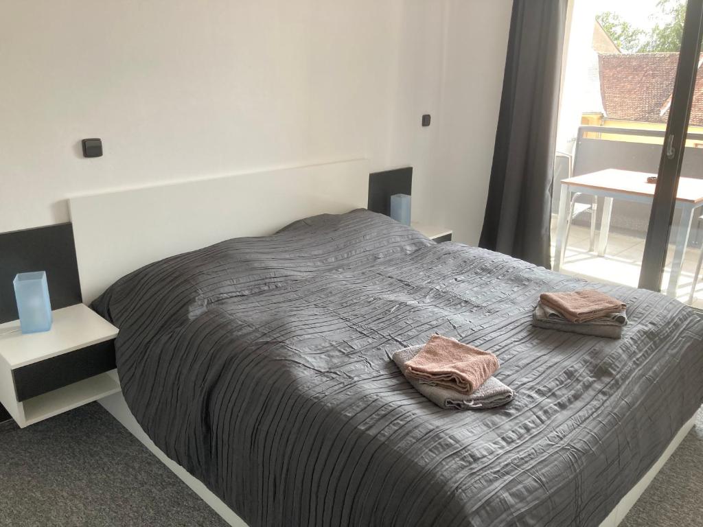 Postel nebo postele na pokoji v ubytování Apartmány Grasel