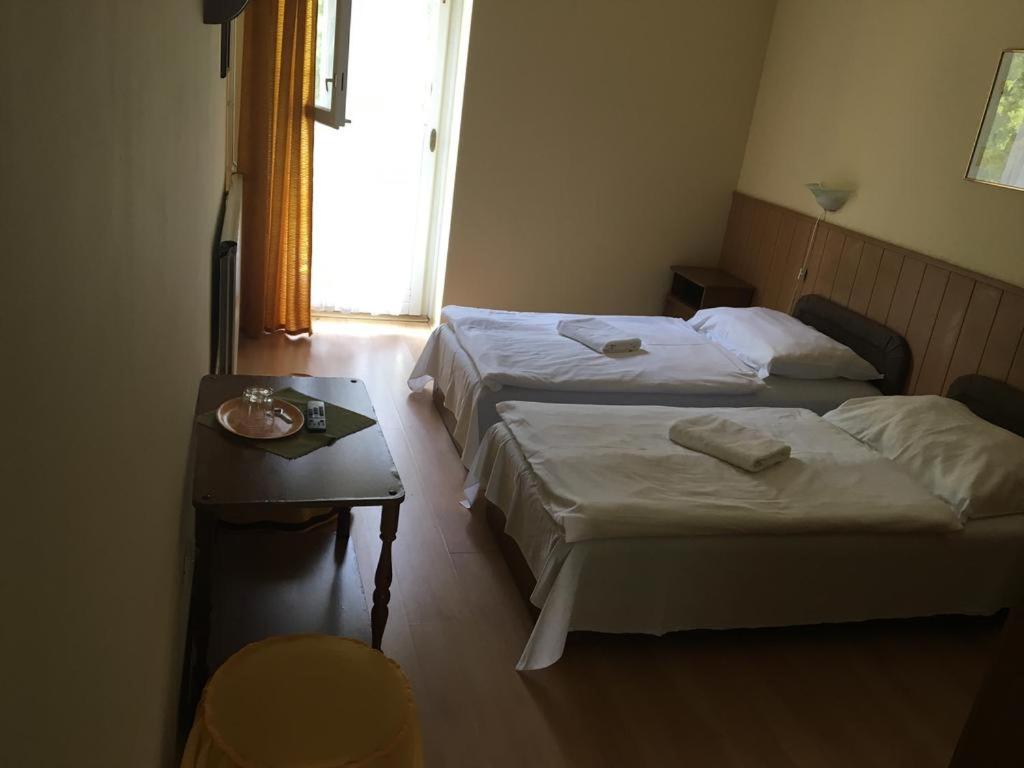Cama o camas de una habitación en Muskátli Panzió