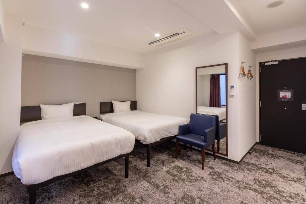 Postel nebo postele na pokoji v ubytování Hotel Tetora Kyoto Station