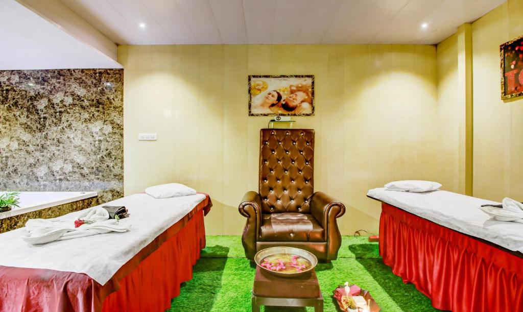 Postel nebo postele na pokoji v ubytování Hotel Shree Daan