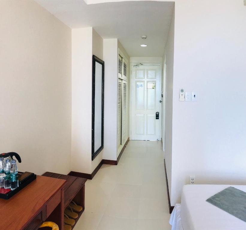 Postel nebo postele na pokoji v ubytování The Coast Hotel Vung Tau