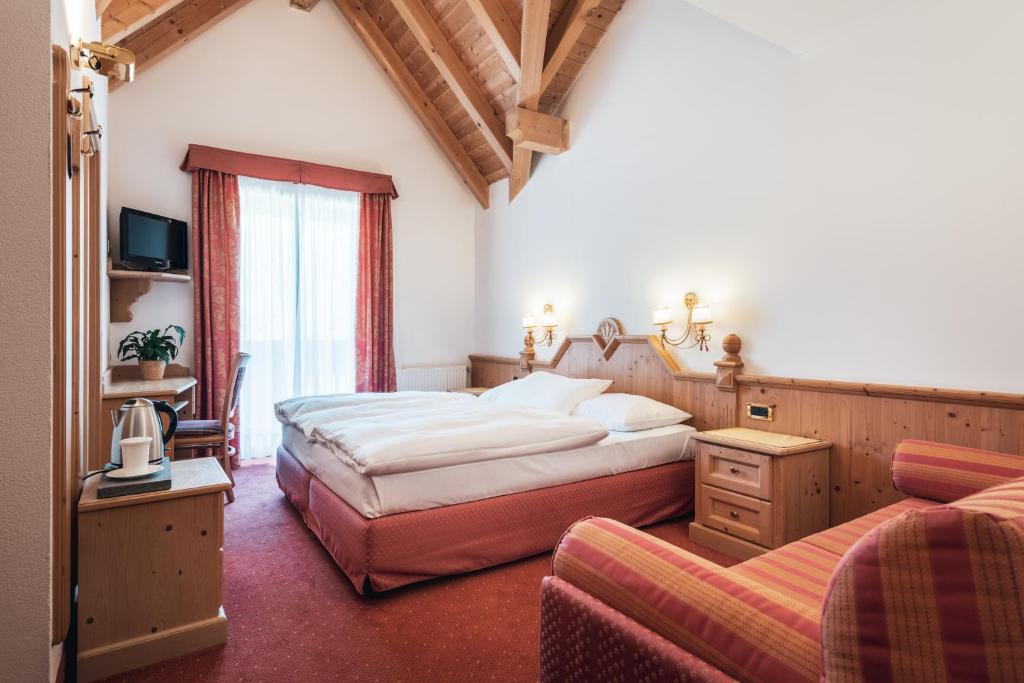 Posteľ alebo postele v izbe v ubytovaní Hotel Chalet Corso