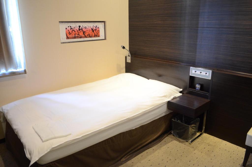Postel nebo postele na pokoji v ubytování My Hotel Ryugu