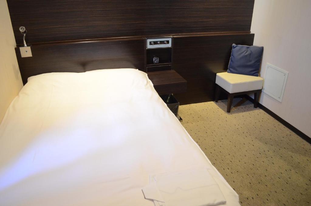 Postel nebo postele na pokoji v ubytování My Hotel Ryugu