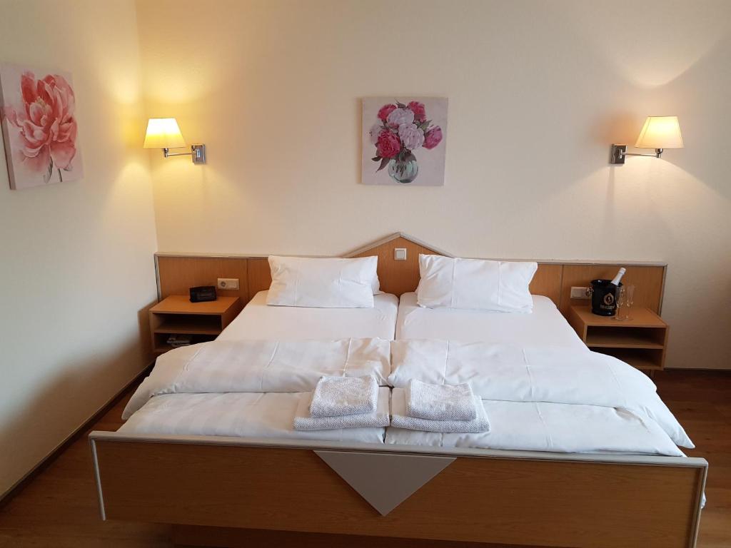 Postel nebo postele na pokoji v ubytování Hotel Penterknapp