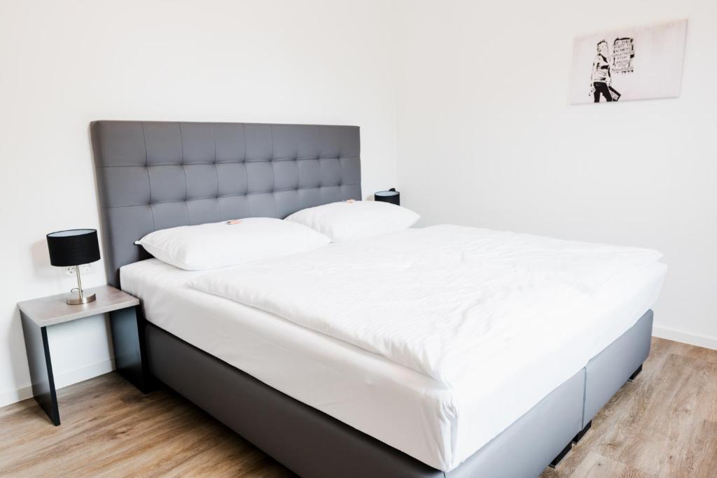 Postel nebo postele na pokoji v ubytování Müllner Smart Hotel Wien Self Check In