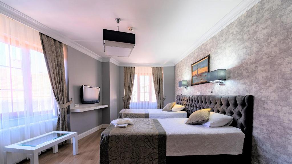 Postel nebo postele na pokoji v ubytování Levent Hotel Istanbul